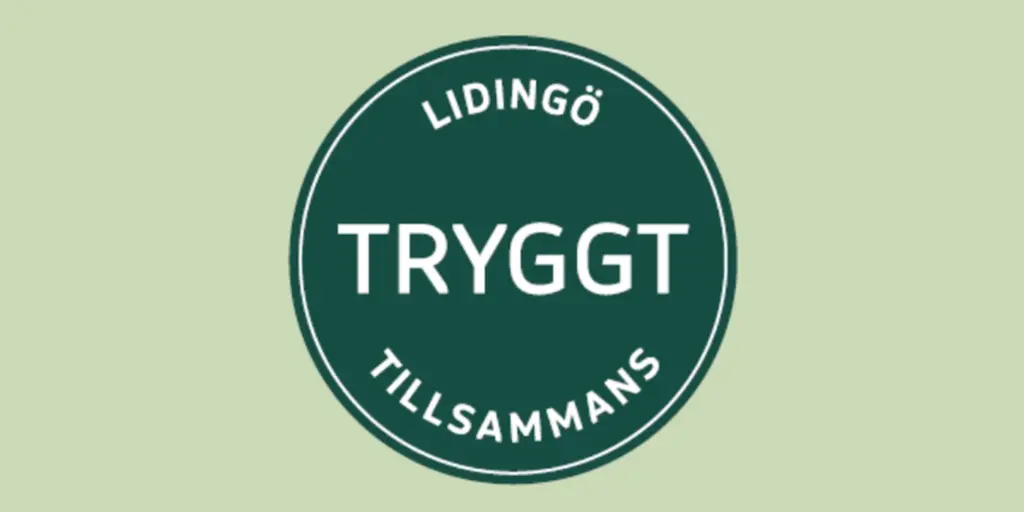 En grön och vit skylt där det står tryggt tillamans.