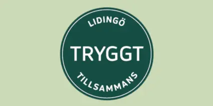 En grön och vit skylt där det står tryggt tillamans.