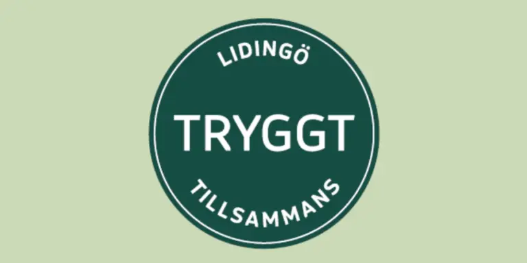 En grön och vit skylt där det står tryggt tillamans.